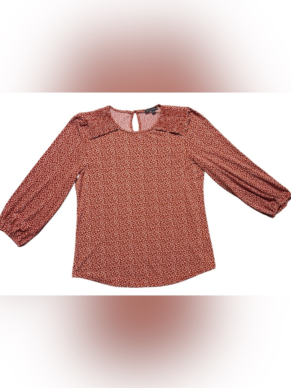Women's small long-sleeve Adrianna Papell rust-colored blouse.